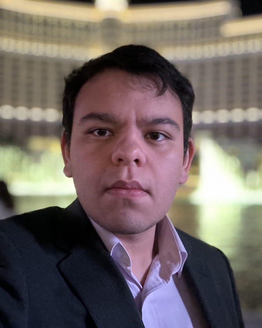 Emilio Puente, photographed in the evening wearing a dark jacket and open collar.